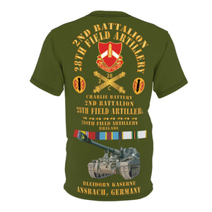 Unisex Cut & Sew Tee (AOP) - C Battery,  2nd Bn 28th Artillery - 210th FA Bde - Ansbach Germany  w M109 w Overseas Cold SVC